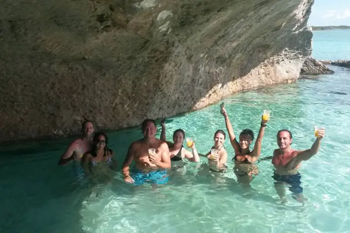 a group of people swimming in a pool of water