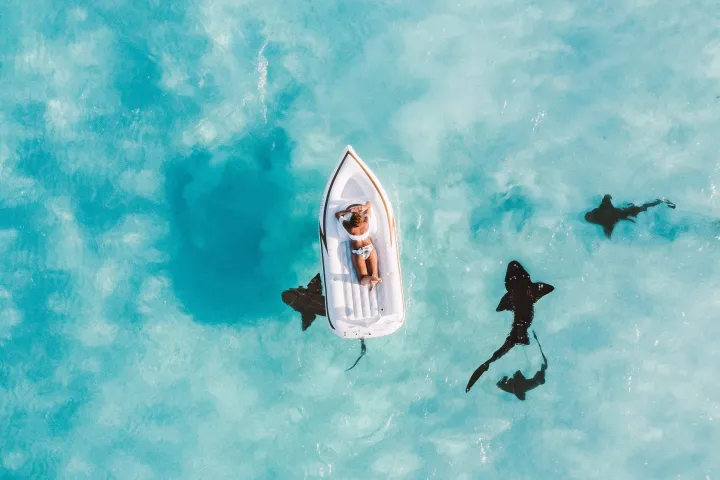 a person on a floater floating in the sea